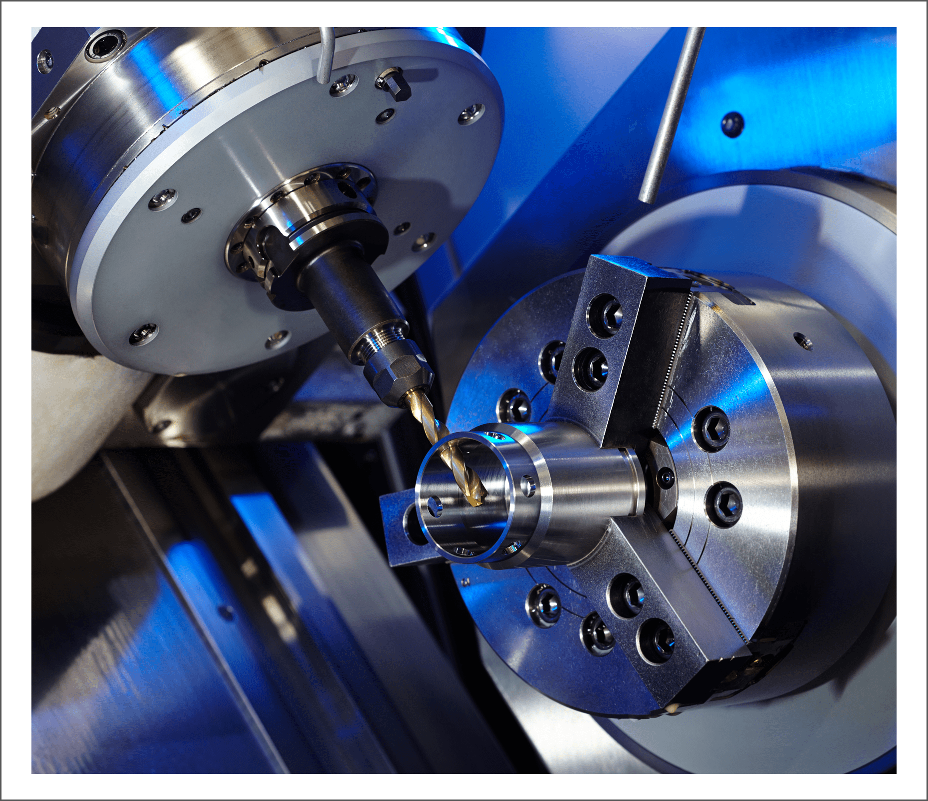 CNC machine operating with metal drill bit.