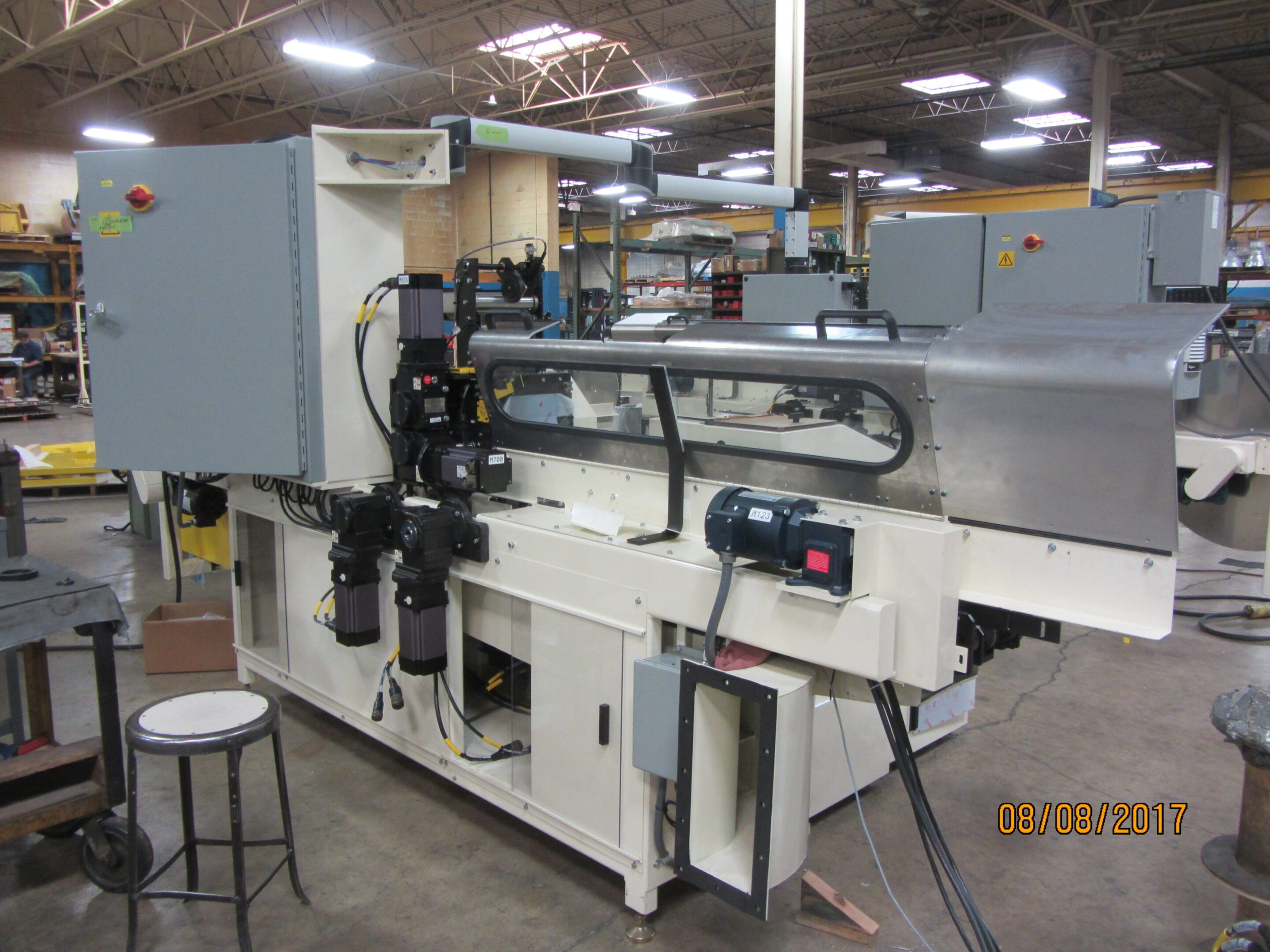 Industrial packaging machine in a factory setting.