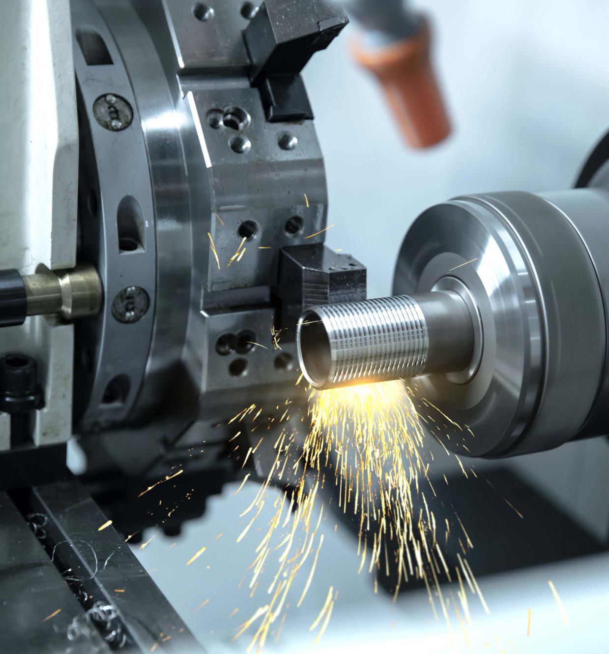 Metal lathe machine producing sparks.