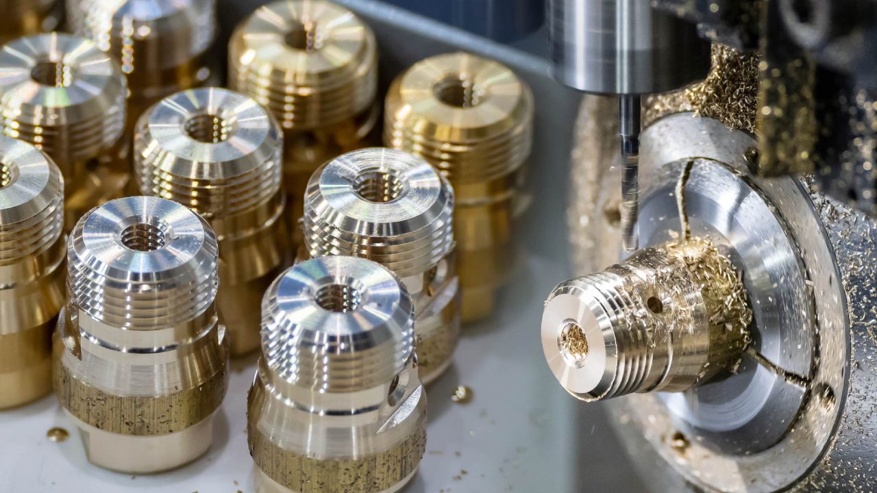 Metal parts being machined and polished.