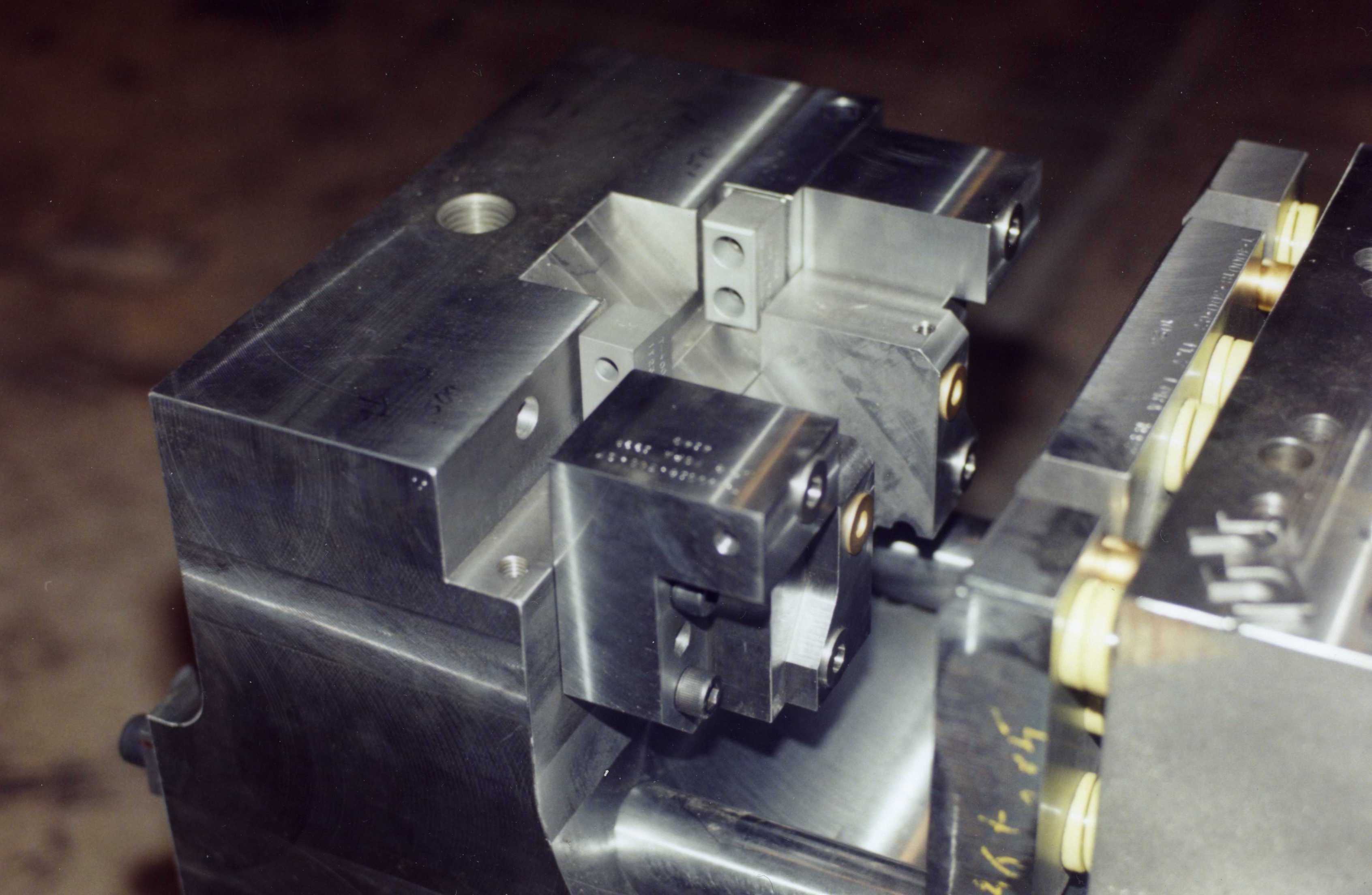 Close-up of a precision metal machining process with a cutting tool.