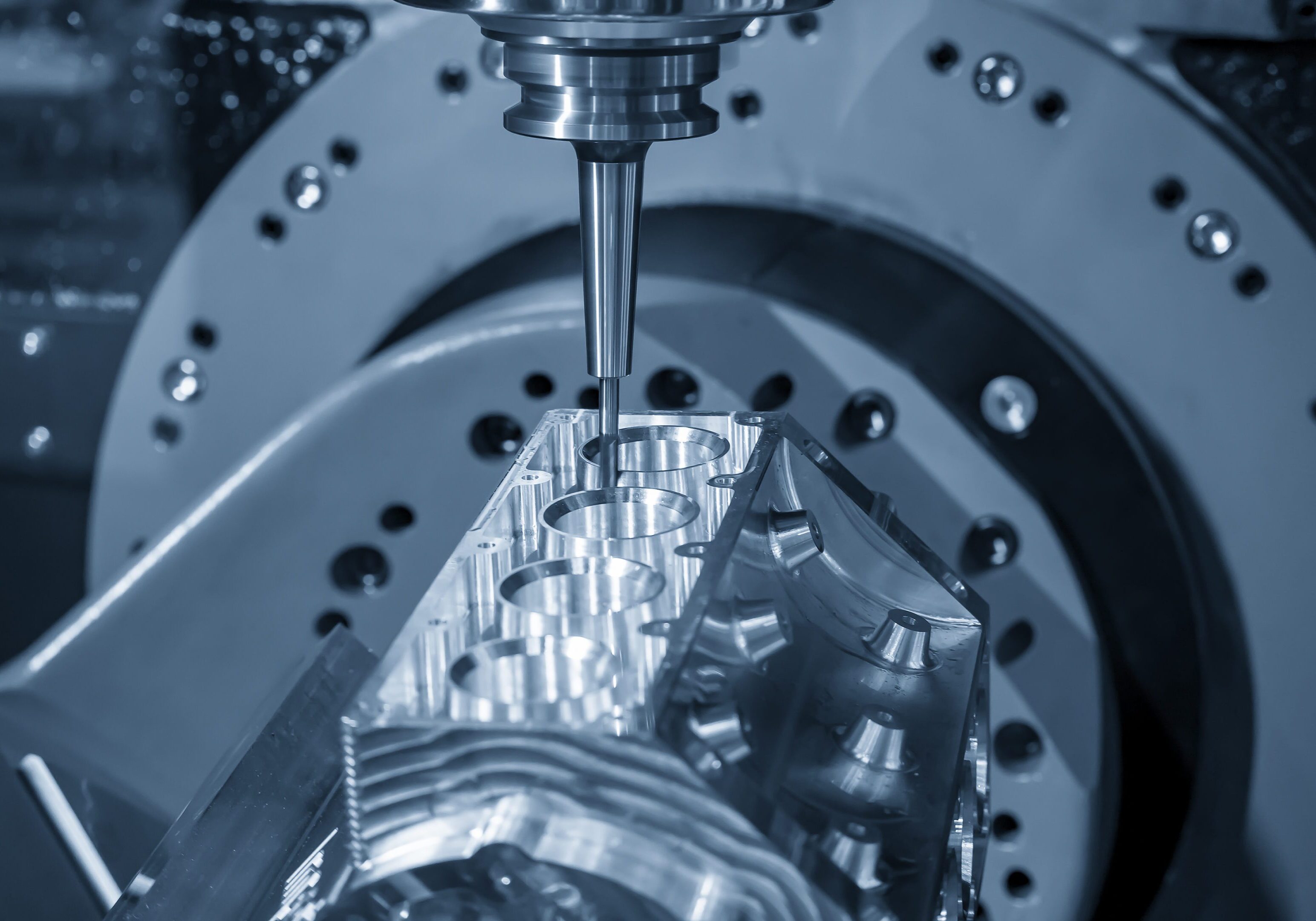 CNC machine milling metal component.